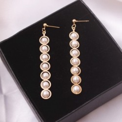 Elegant long golden earrings - geometric metal with pearlsEarrings